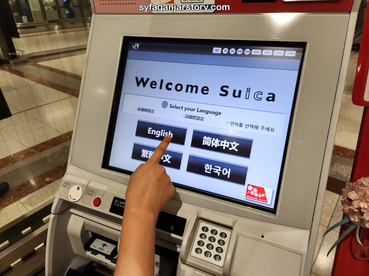 Pilih bahasa di mesin welcome suica